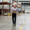 Facility manager inspecting industrial floor